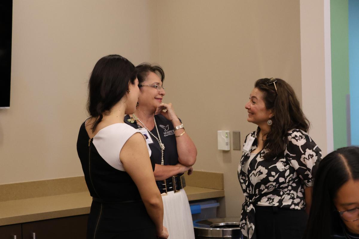 Attendees of the September 2026 Quarterly Partner Meeting mingling with one another in between sessions