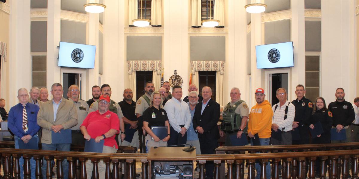 A group photo of veterans with County Mayor Chad Graham in the second floor courtroom of the historic Bedford County Courthouse.