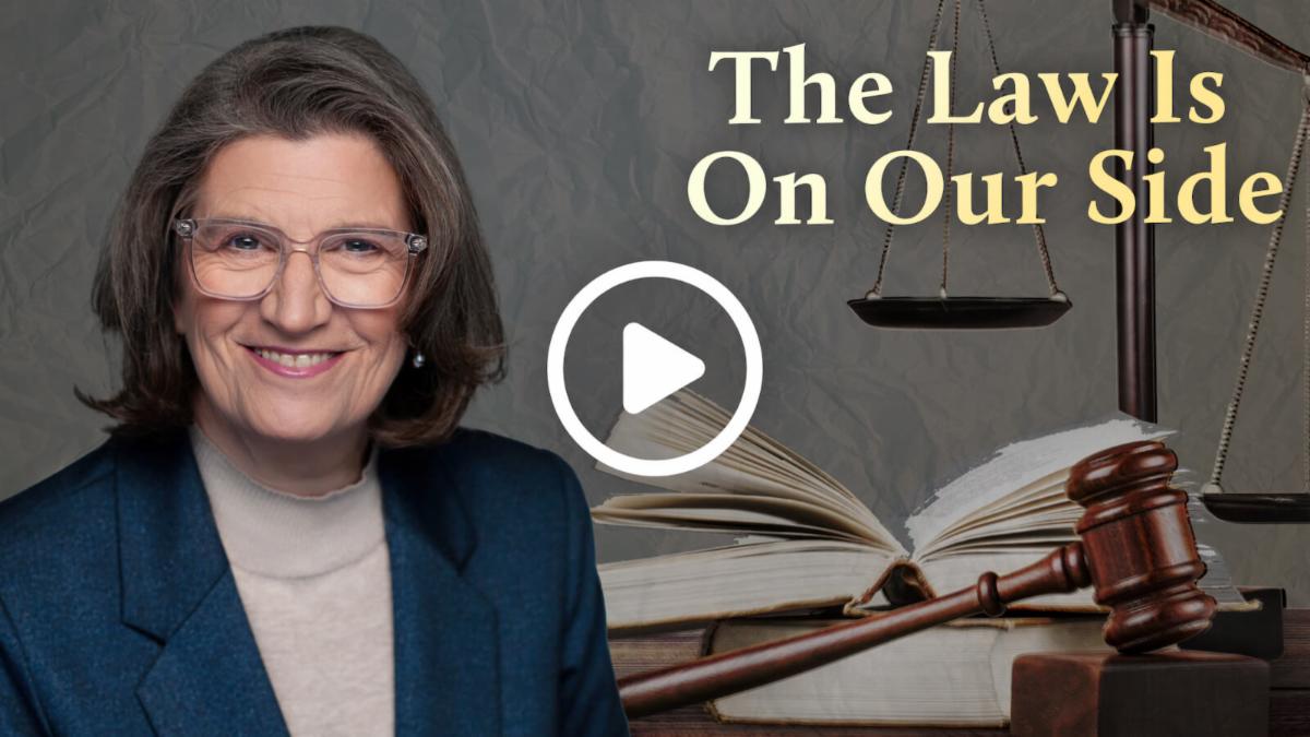 photo of Mary Holland with books in the background and the words the law is on our side