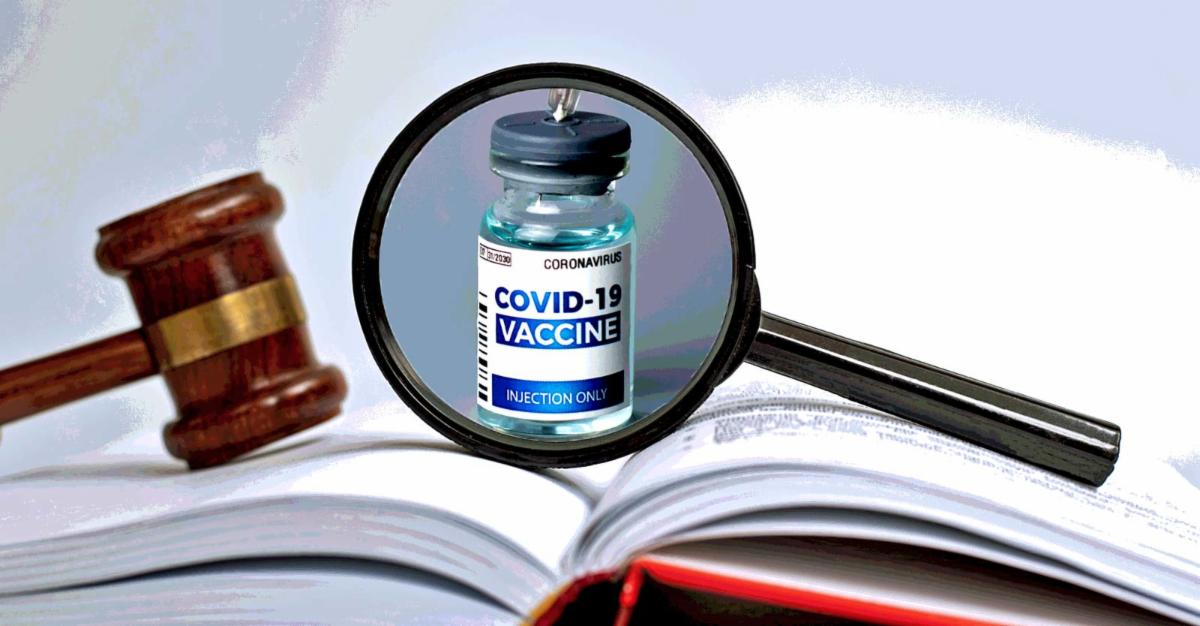 gavel on book and covid vaccine inside magnifying glass 