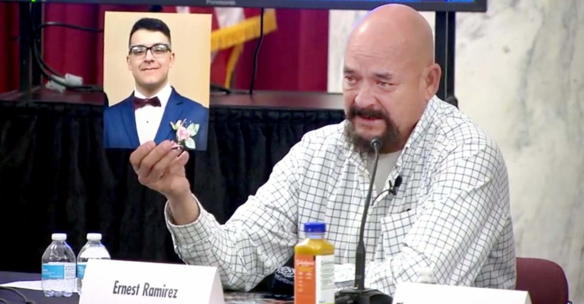 ernesto ramirez holding picture of his son junior