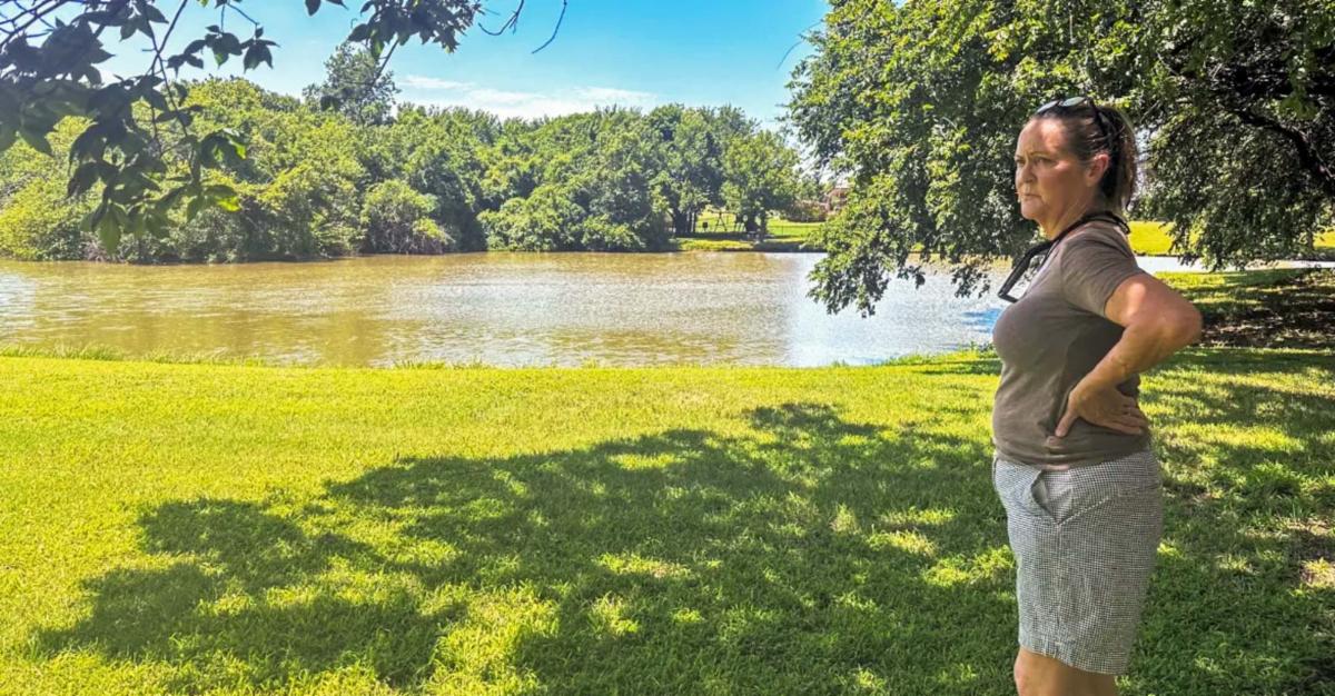 woman standing near water