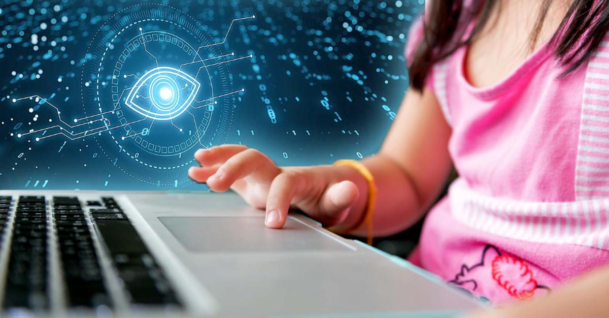child on laptop with surveillance eye