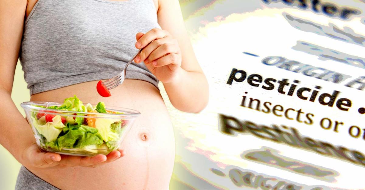 pregnant woman eating a salad