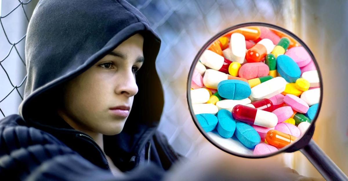 depressed teenage boy and pills