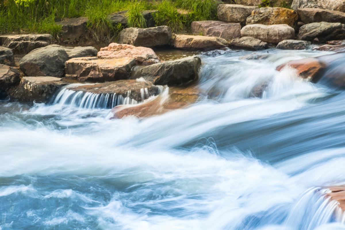 A stock image of water running downstream.