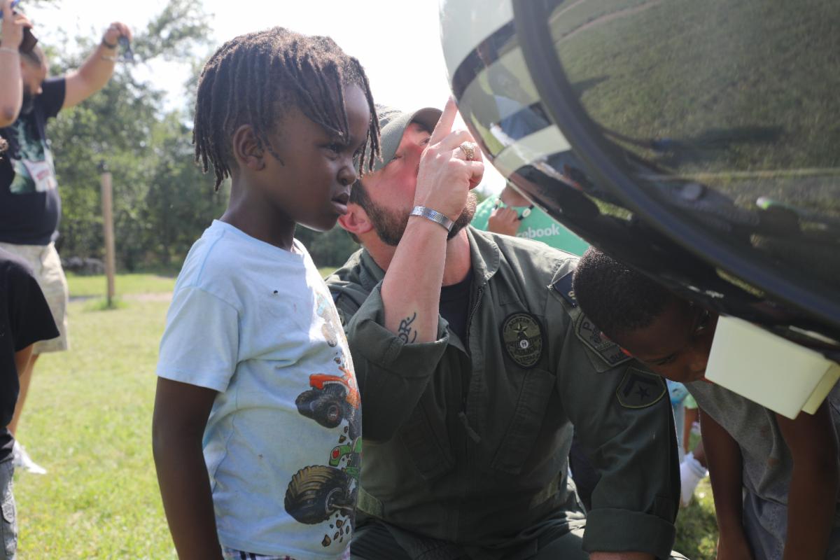 Child looking inside the helicopter