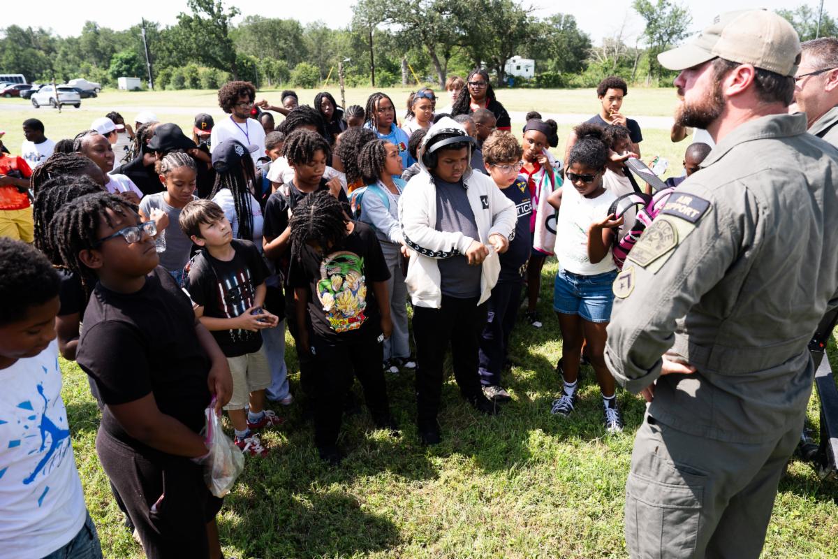 Public safety professional speaking with campers