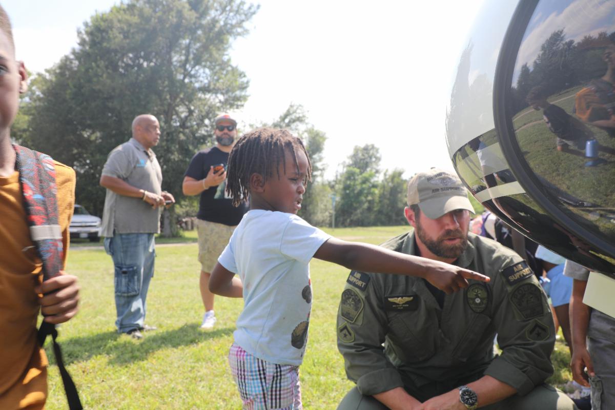 Public safety professional explaining helicopter equipment