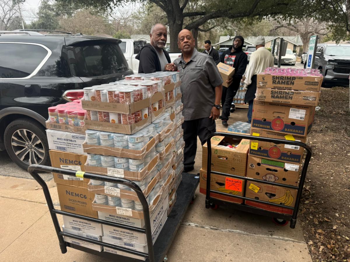 Food pantry volunteers unloading food donations
