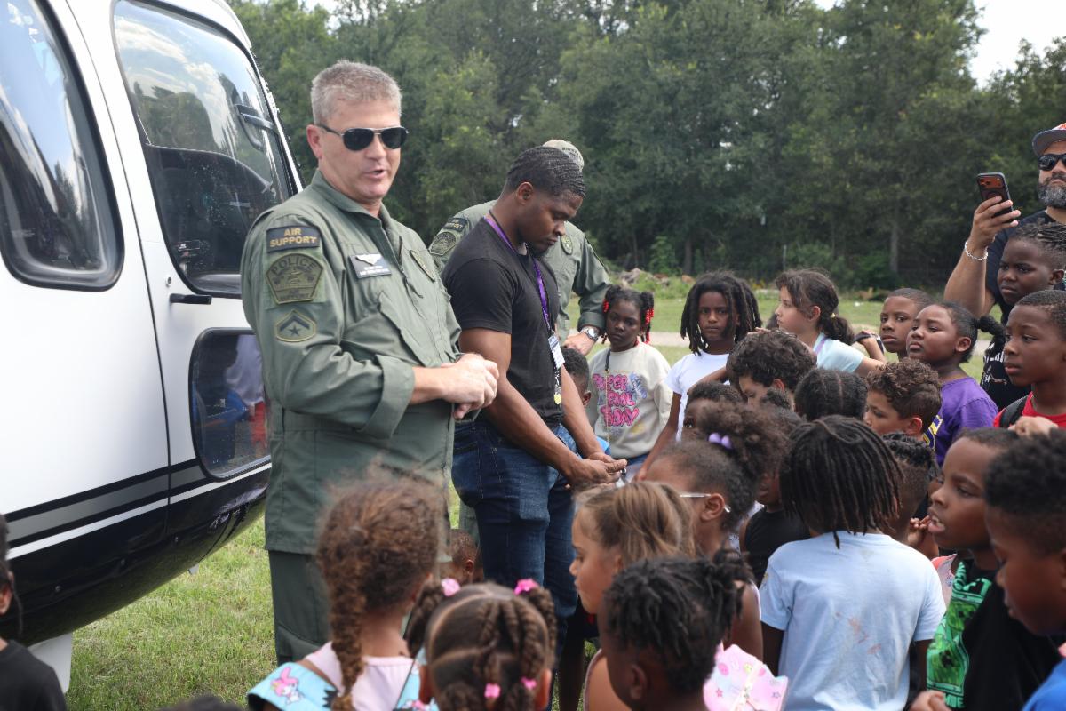 Campers learning from aviation support staff