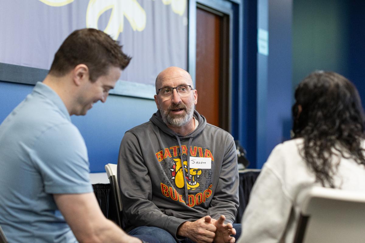 Group of professionals having discussion during seminar