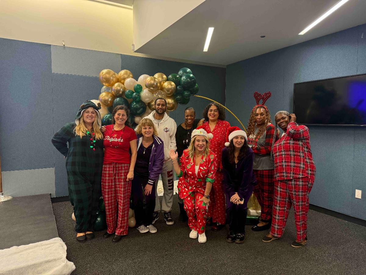 LACC president and staff at holiday pajama party