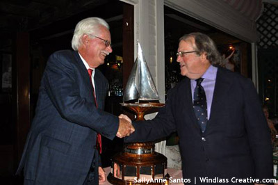 Dennis Williams accepts Ted Turner Trophy from Commodore James Gubelmann