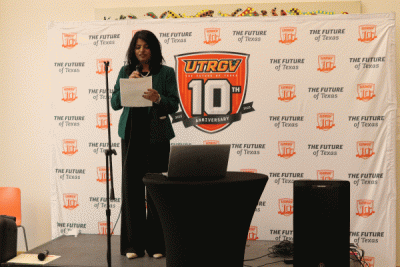 GIF showcases multiple artwork, and a lady on stage. 