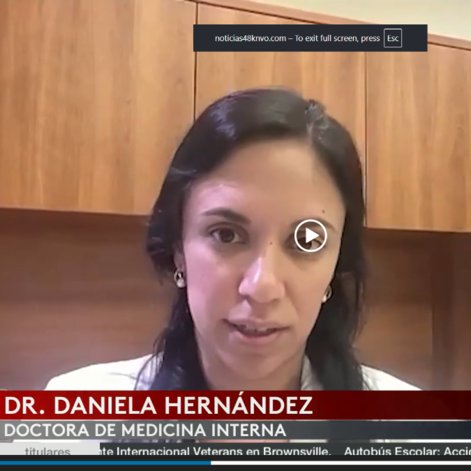 A woman is speaking in a video call, identified as Dr. Daniela Hernández, an internist. She appears in an office setting, conveying professionalism.