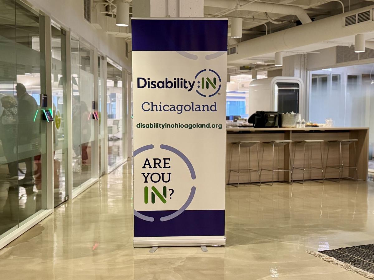 Photo of a Disability:IN Chicagoland banner in the hallway at the Allstate offices.