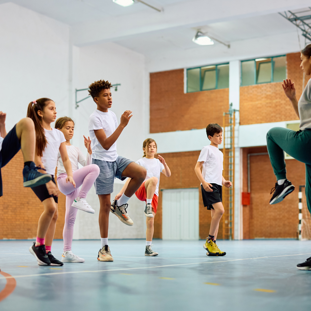 Adult teaching youth how to exercise