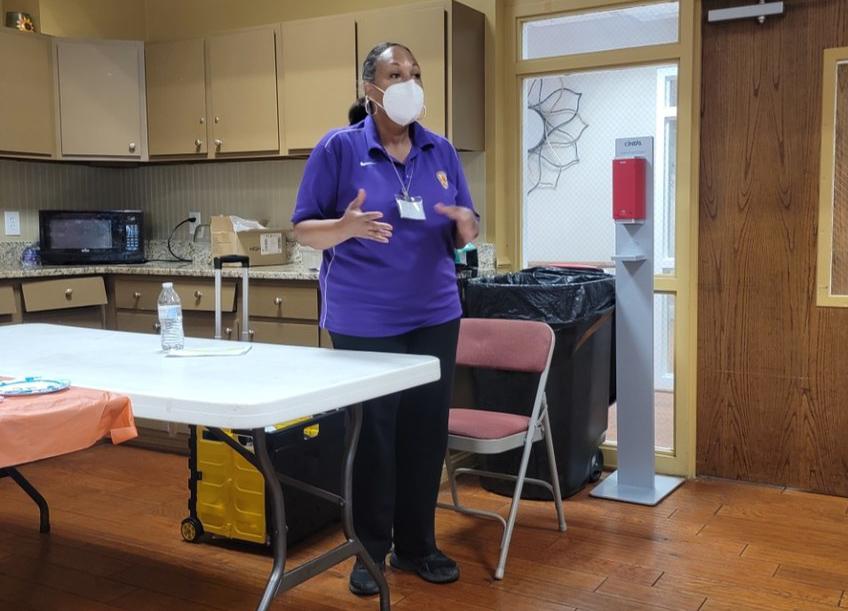 woman standing and speaking