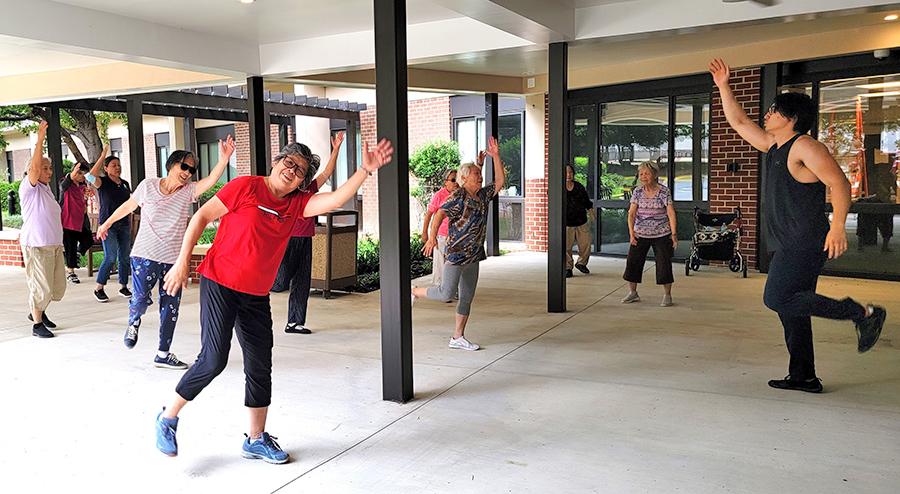 residents being led in an exercise class by David Park