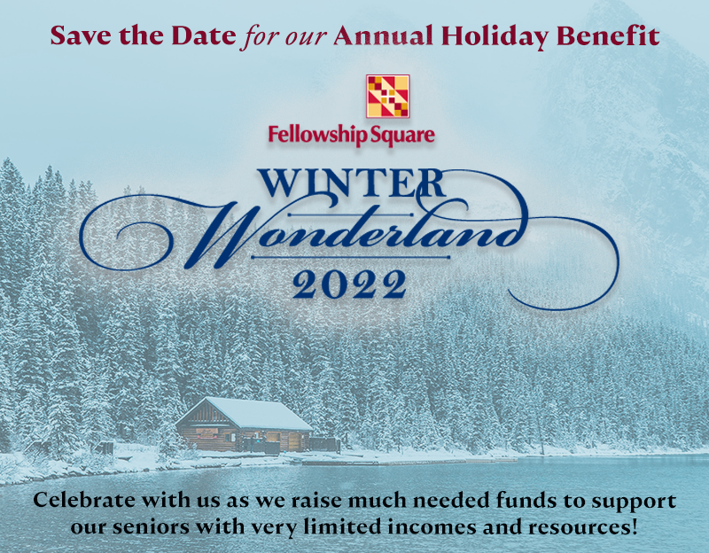 Save the date for our Annual holiday benefit Winter Wonderland 2022 logo on background of a cabin on a lake with snowy trees behind it