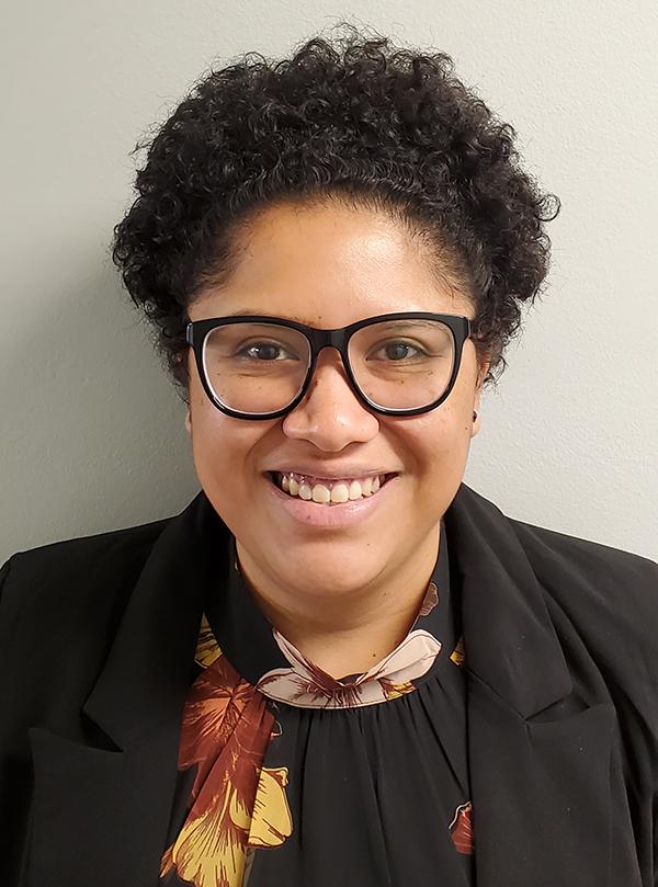 Brenda Martinez headshot young woman with glasses