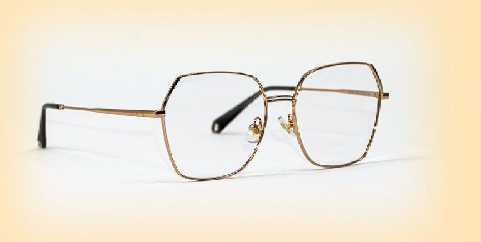 wire rimmed glasses on a yellow background
