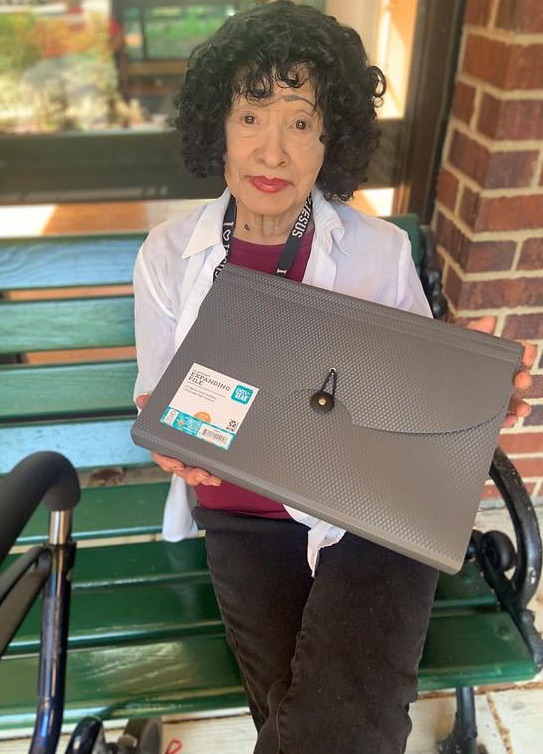 woman holding a file folder