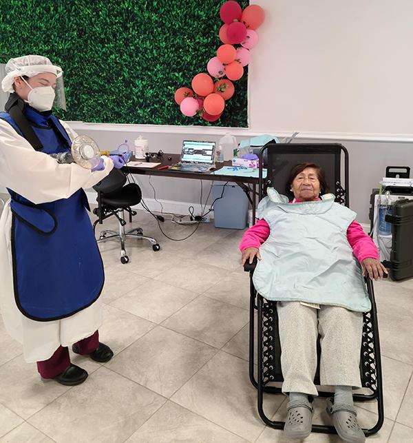 dentist and patient with balloons in background