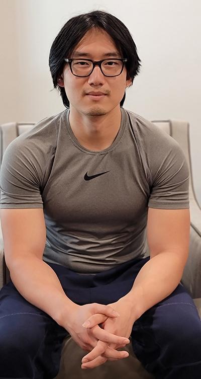 David Park seated with hands clasped