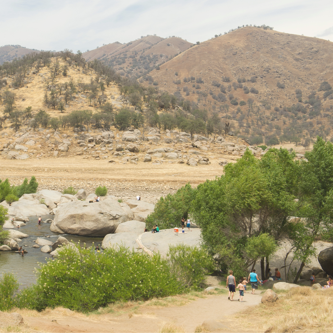 People swimming in a lake and walking on trails in Tulare County.