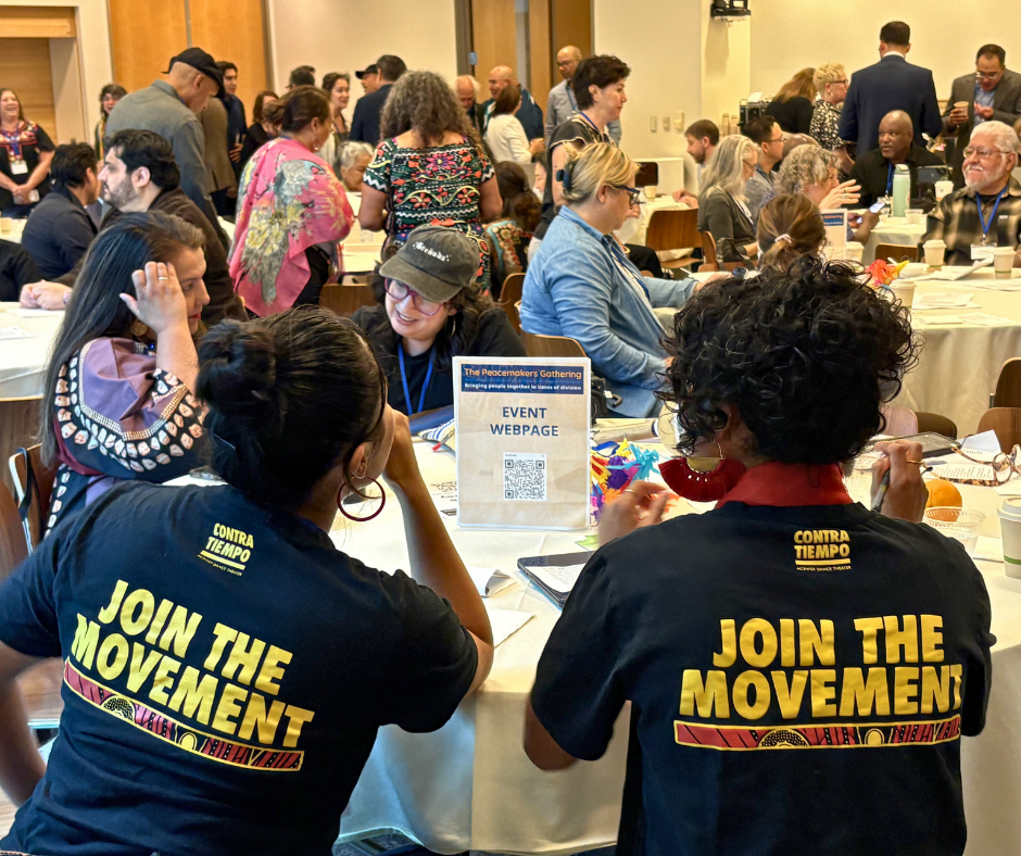 A crowded room of attendees, speakers, and special guests at the Peacemaker's Gathering in Los Angeles.