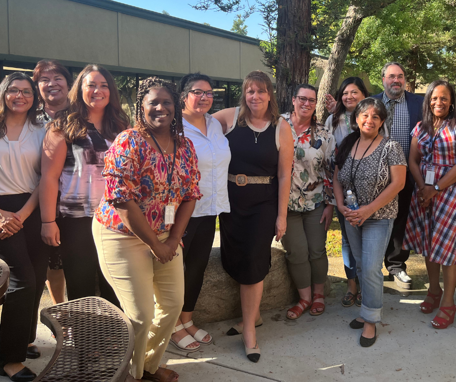 CRD staff smile together in a group photo outside the Bakersfield office.