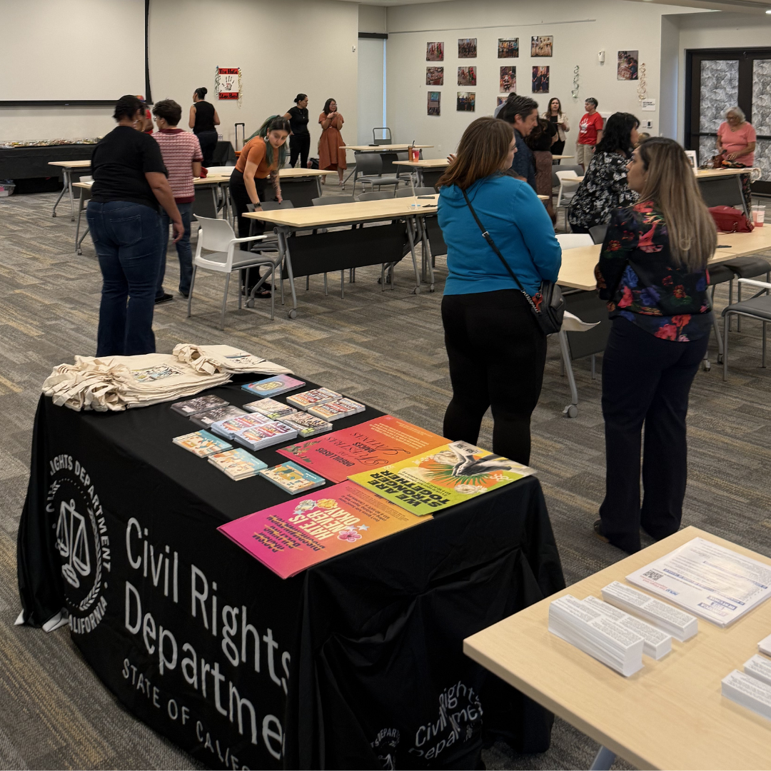 A California Civil Rights Department resource table during an event in Imperial Valley.
