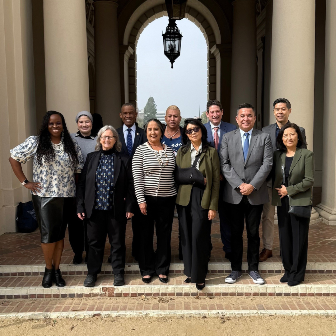 Members of the California Commission on the State of Hate stand with community partners.