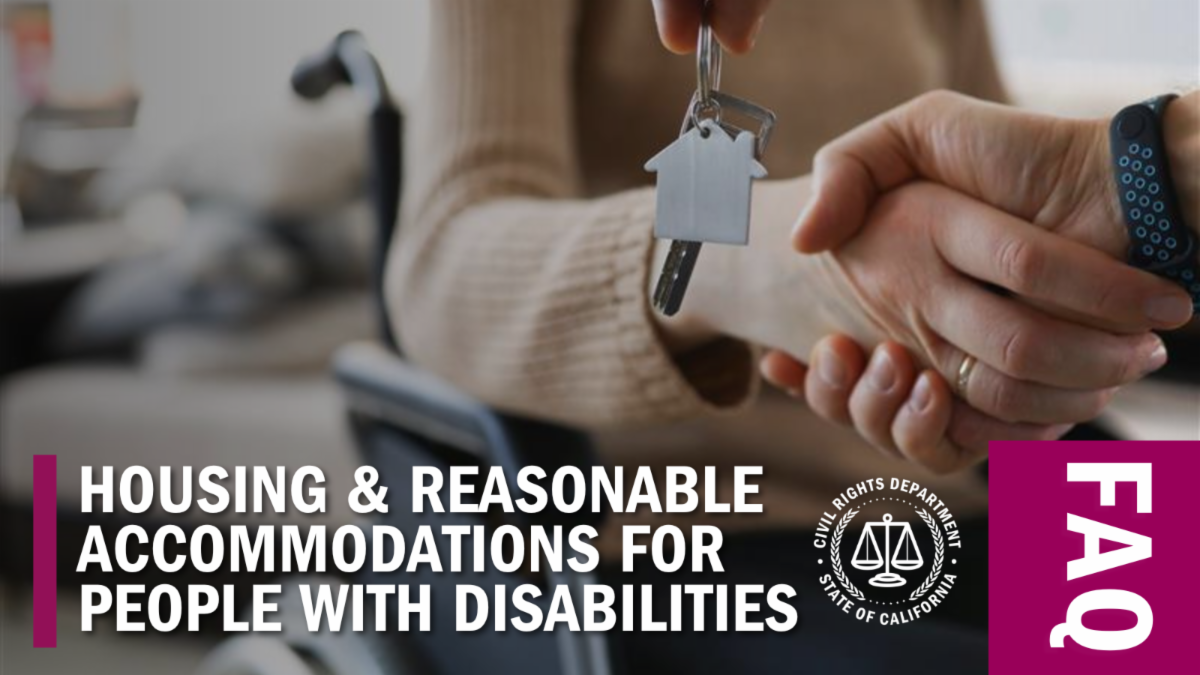Someone in a wheelchair shakes hands with a housing provider as they get the keys to new housing.