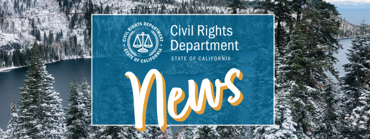 Lake Tahoe in the winter with snow on the mountains, trees, and ice on the lake.