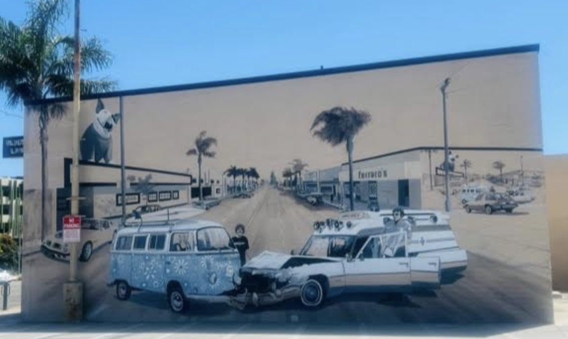 A WV looking van crashing into a station wagon depicted on a mural in midtown Ventura