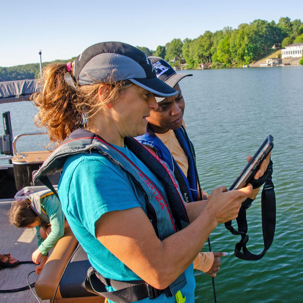 Ferrum College Instructor of Biology Check Lash works with student