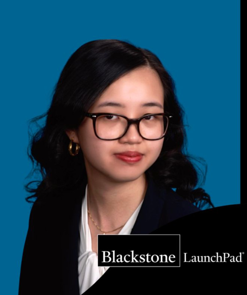 Headshot of Wu Wu with against a blue background