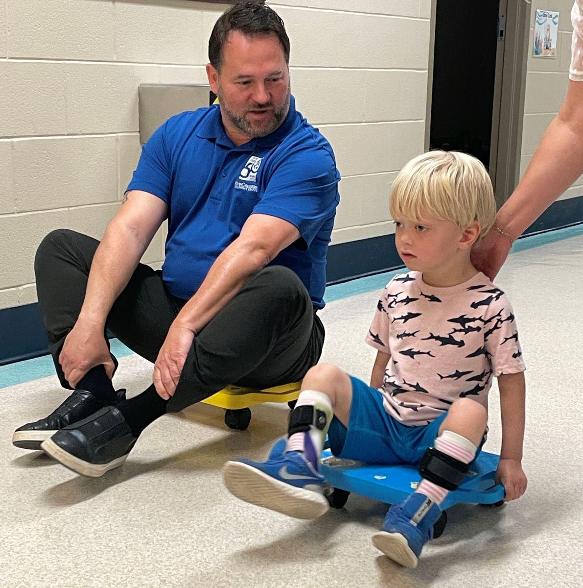 Scott and Hamish race down the hallway