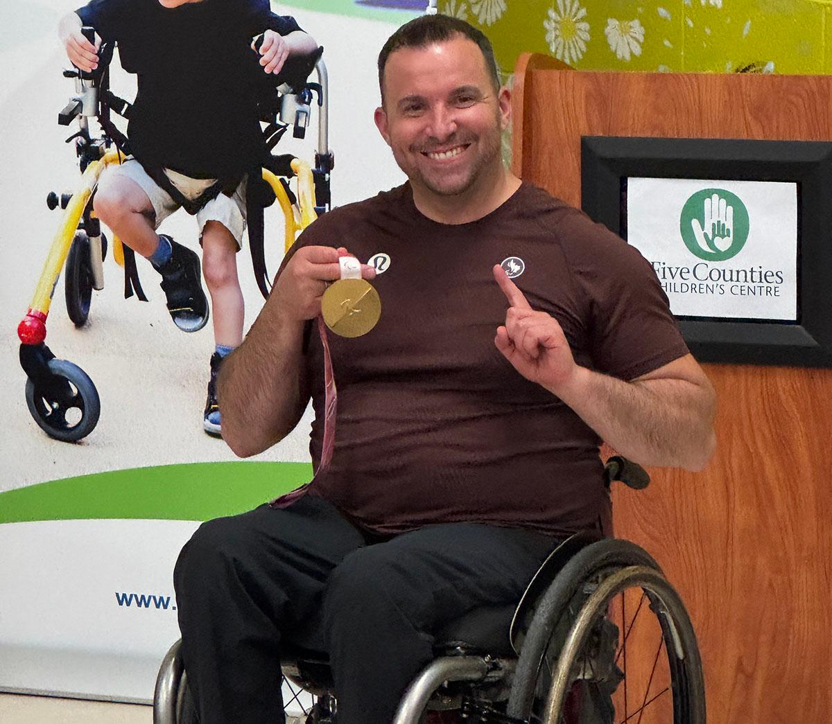 Paralympian Jon Thurston shows  his gold medal