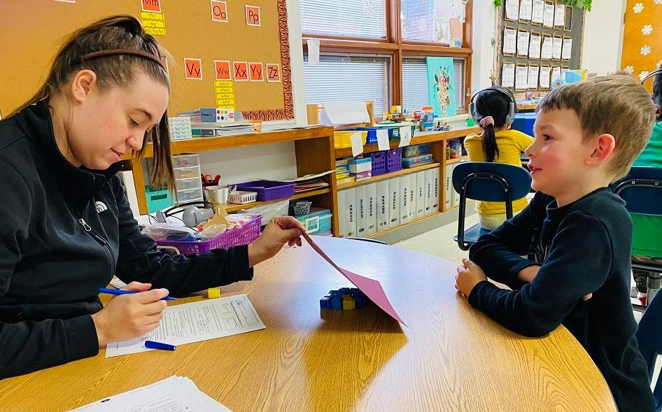 Teacher working with a student