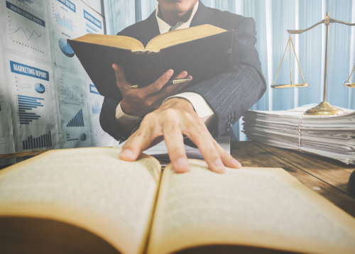 Lawyer learning about law states public property for the people Real Estate Information Center_ vintage filtered.