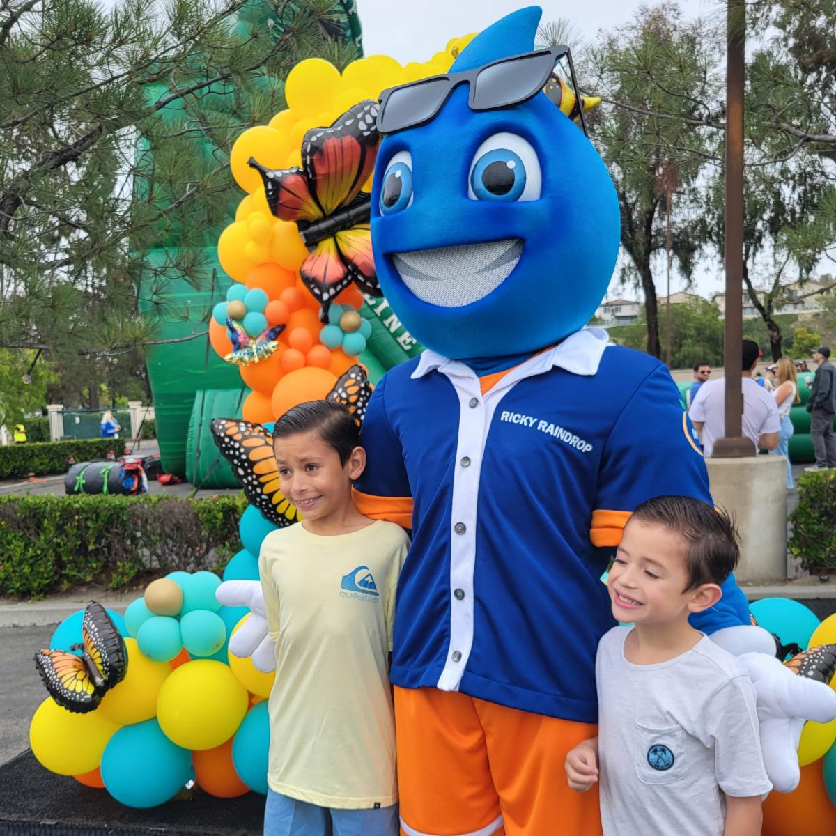 mascot ricky raindrop with kids at event