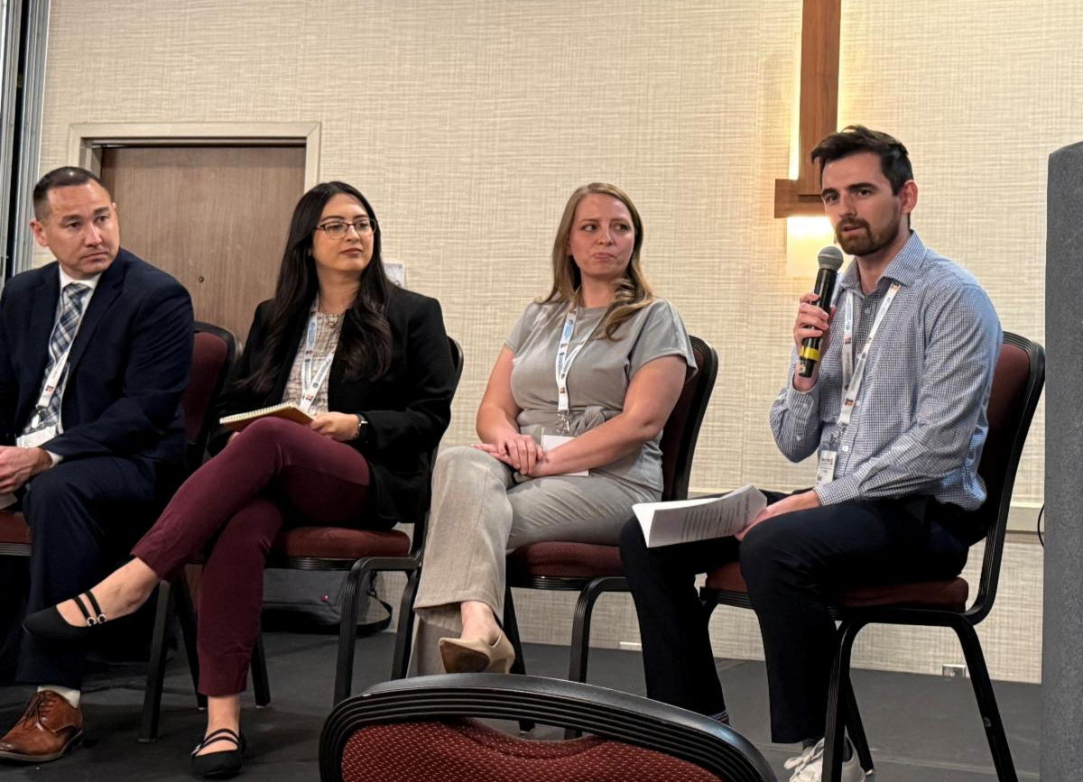 Sam Fetter moderating at a conference