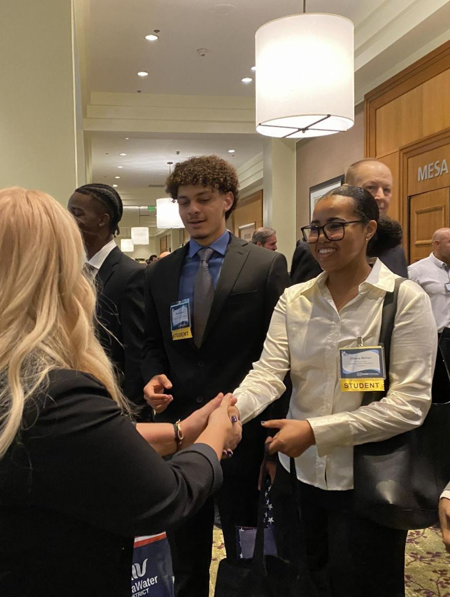 Students shaking hands at OC Water Summit