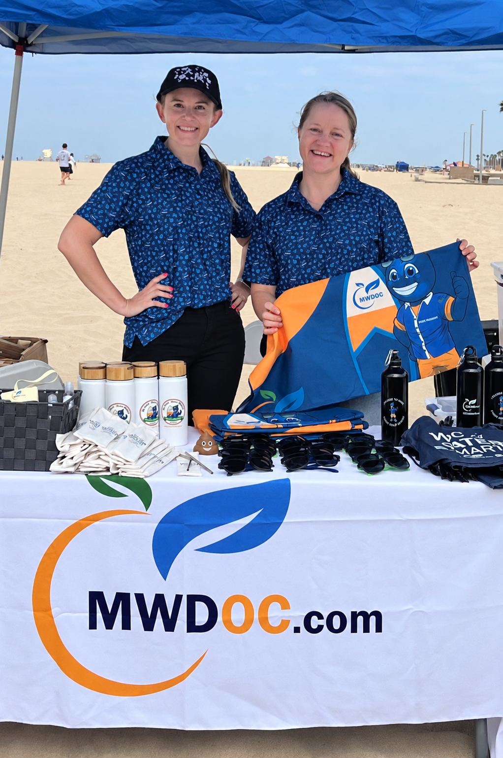 MWDOC Staff at the MWDOC table during the beach cleanup
