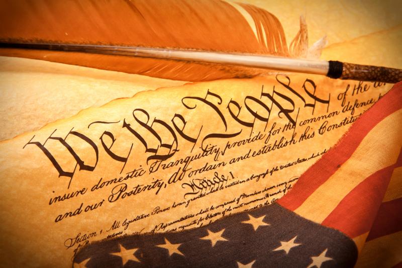 Old fashionet American Constitution - We the people with USA Flag.