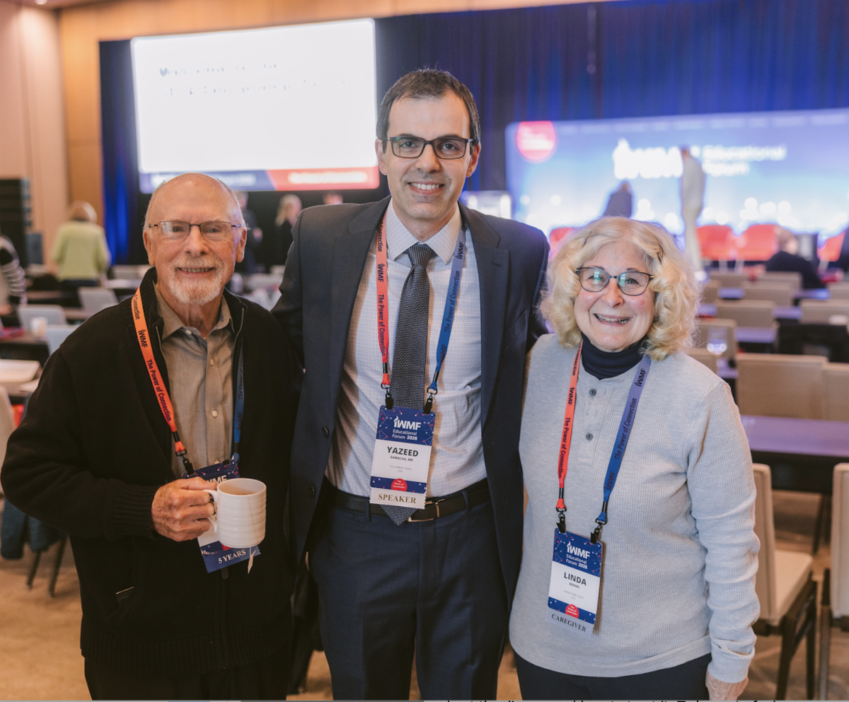 Dr. Yazeed Sawalha connecting with a WM patient and caregiver after his session on Navigating Initial Treatment: Options for WM Patients New to Therapy